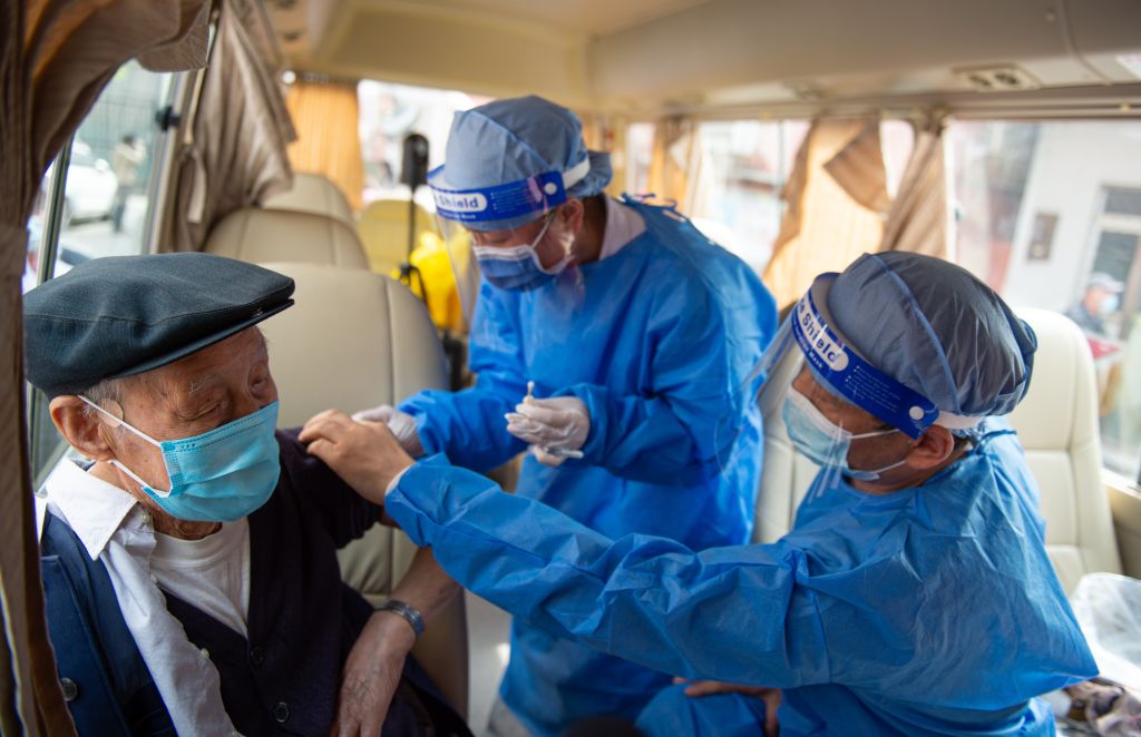A senior citizen receives a dose of COVID-19 vaccine at a mobile COVID-19 vaccination site in Beijing, China, on April 9, 2022. (Chen Zhonghao—Xinhua/Getty Images)