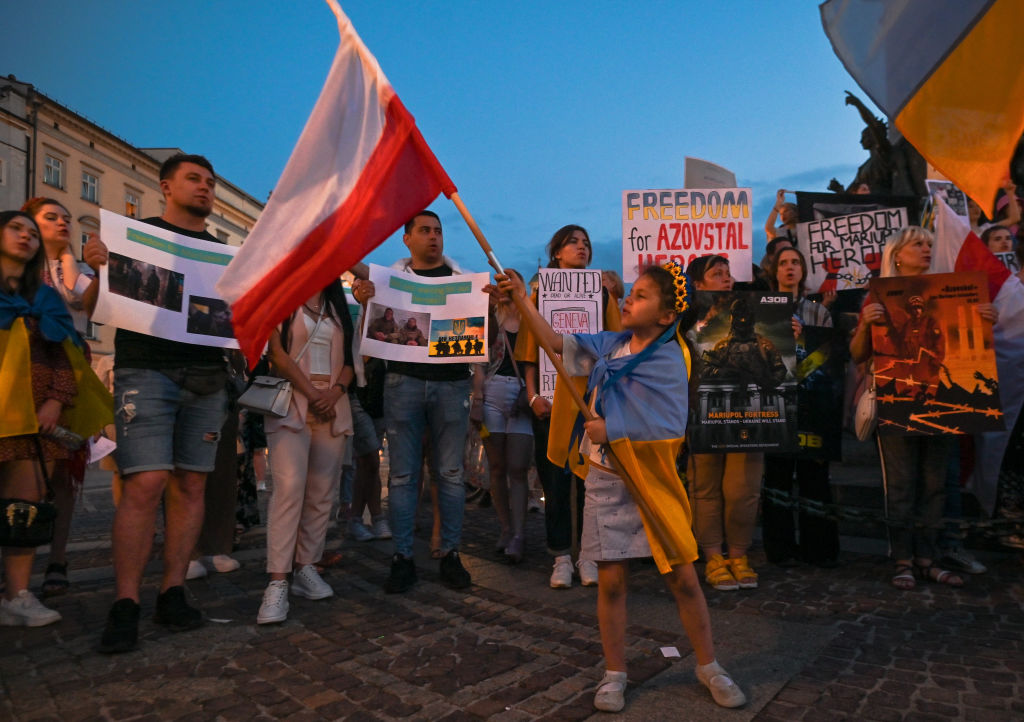 Members of the local Ukrainian diaspora, war refugees, peace activists, volunteers and local supporters during the 'Be Brave Like Azovstal Heroes' demonstration in defense of the heroic soldiers of Azovstal on the 122nd day of the war.
                      On Saturday, June 25, 2022, in Main Market Square, Krakow, Poland. (Artur Widak-NurPhoto)