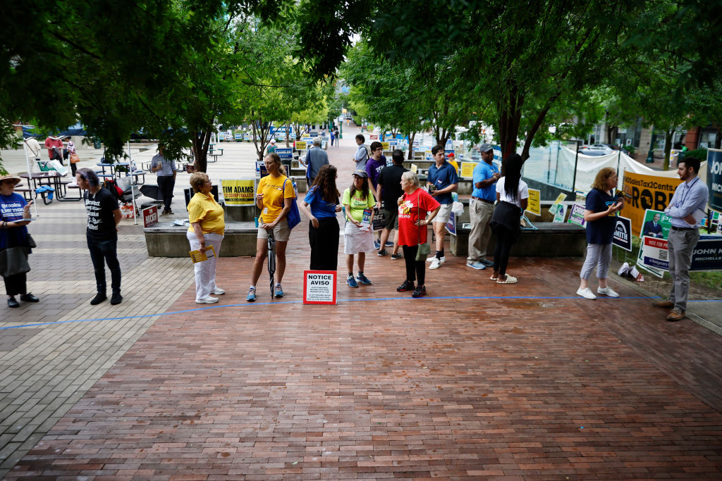 Campaign volunteers wait outside the Silver Spring Civic Building at Veterans Plaza during the first day of early voting on July 07, 2022 in Silver Spring, Maryland. Election Day is July 19. (Chip Somodevilla—Getty Images)
