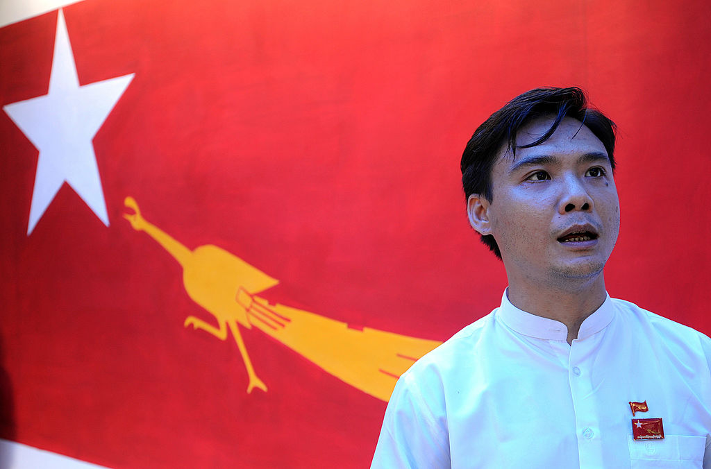 Zayar Thaw talks to reporters following a meeting of the NLD campaign committee in Yangon on April 7, 2012. (Soe Than WIN/AFP via Getty Images)