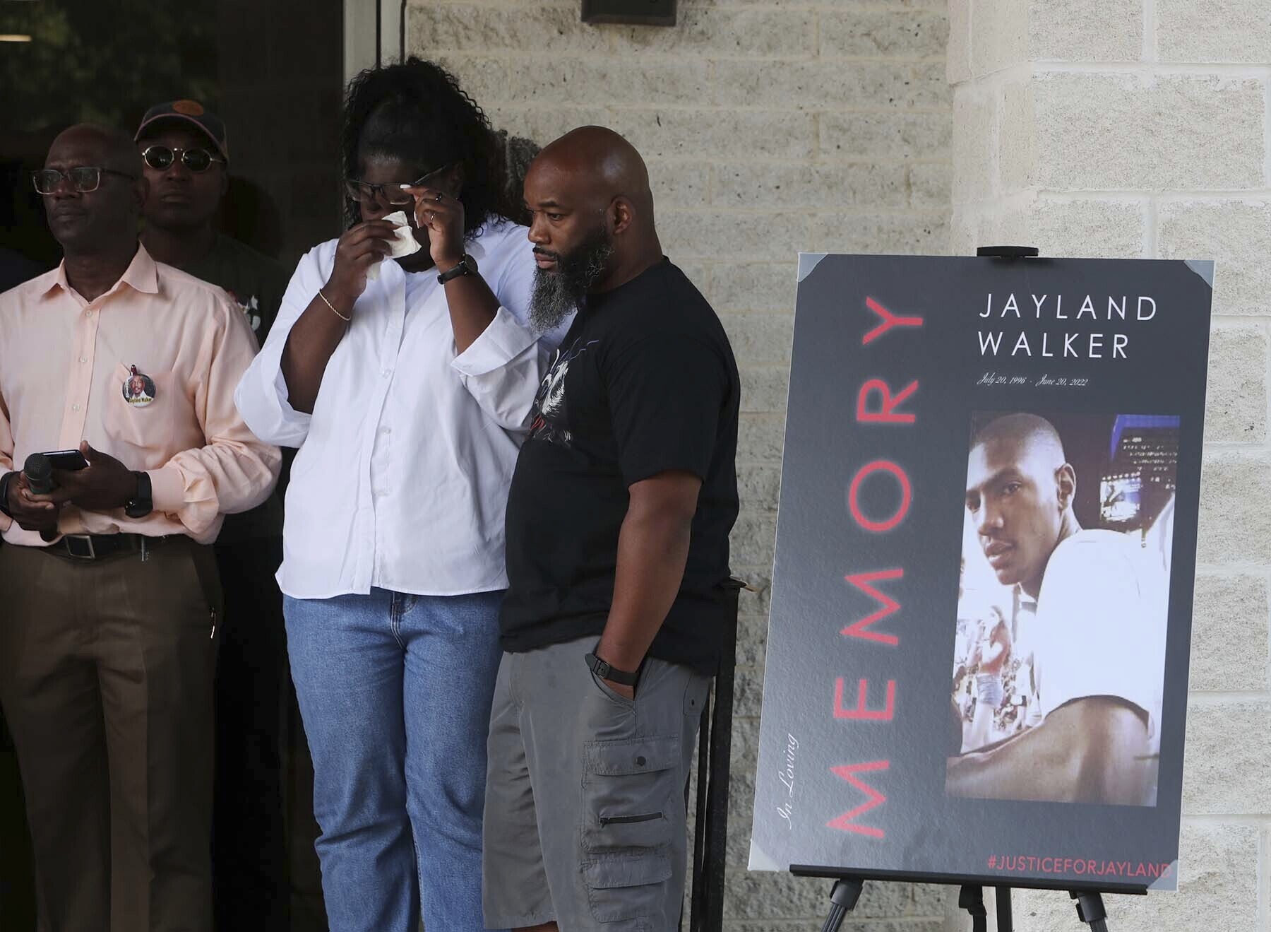 Family members of Jayland Walker stand behind the podium during a news conference at St. Ashworth Temple Church of God in Christ, Monday, July 11, 2022, in Akron, Ohio. (Karen Schiely—Akron Beacon Journal/AP)