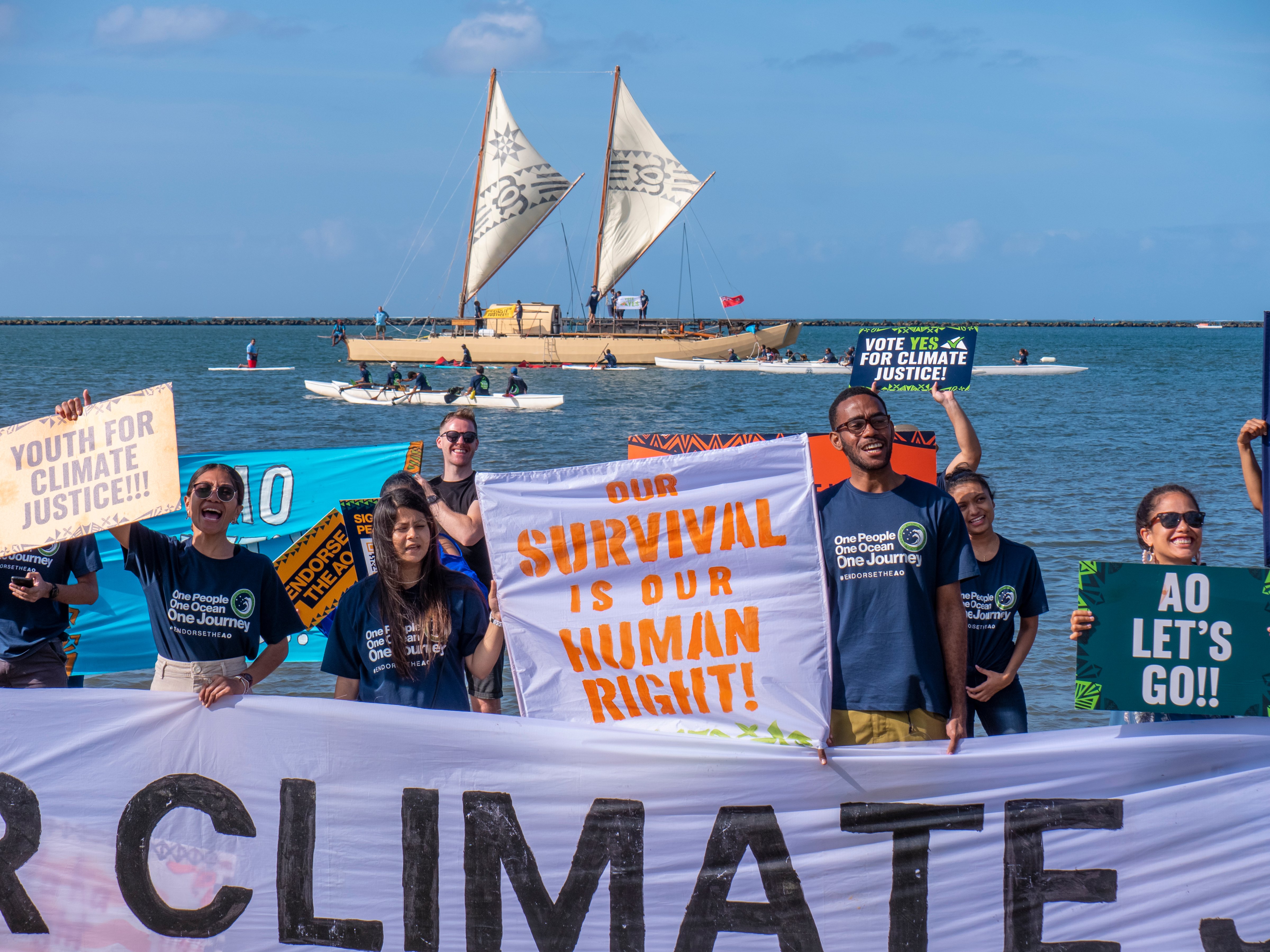 Climate activists call on Pacific Islands leaders to endorse Vanuatu's push for the International Court of Justice to issue an advisory opinion on climate change in Suva, Fiji on July 9, 2022. (Courtesy of Greenpeace Australia Pacific)