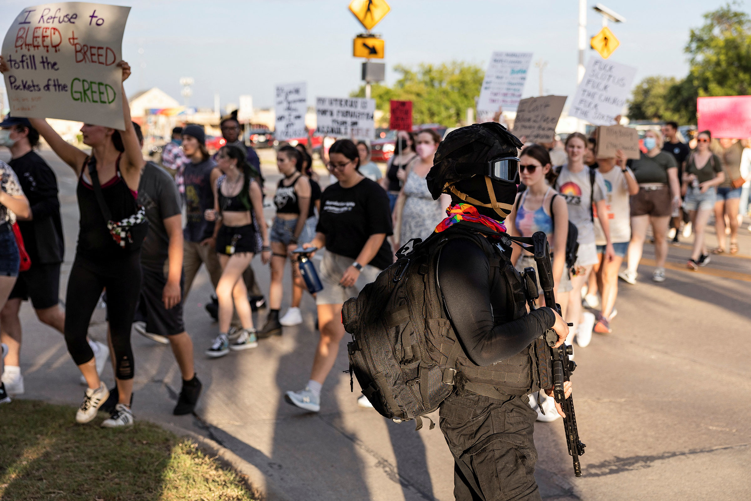 Armed militia members guard the route of abortion rights demonstrators’ march in downtown Denton Texas, on June 28, 2022. (Shelby Tauber—Reuters)