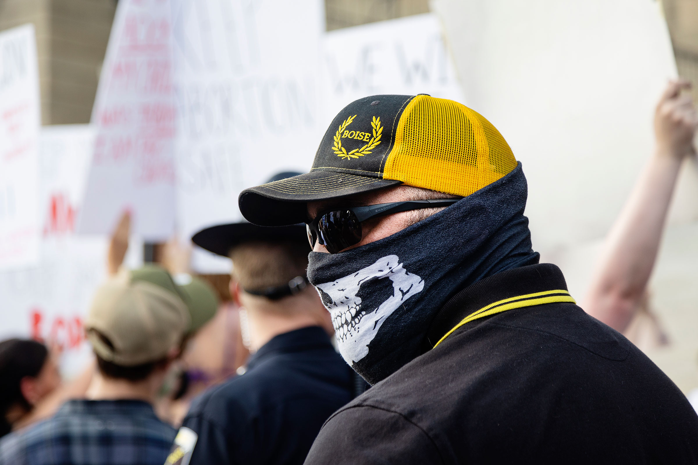 A member of the Proud Boys stands between a group of anti-abortion people attending a celebration and a group of protestors demanding the right to abortion outside of the Idaho Statehouse in Boise, Idaho on June 28, 2022. (Sarah A. Miller—Idaho Statesman/AP)