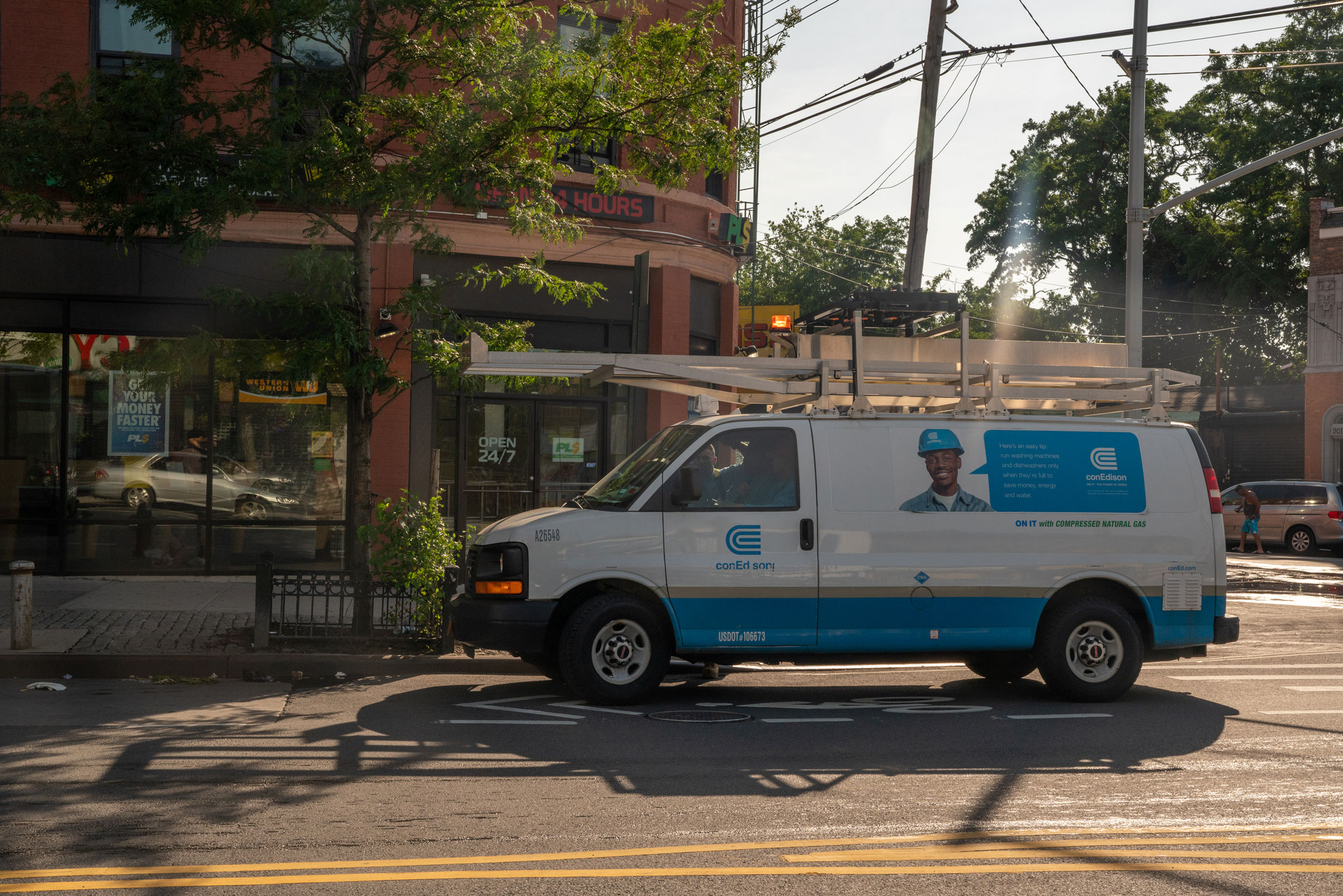 A Consolidated Edison Inc. van sits parked on a street in the Bronx