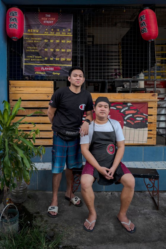 Samerson Orias (right) and his childhood friend Jonathan Artates at their Takoyaki shop