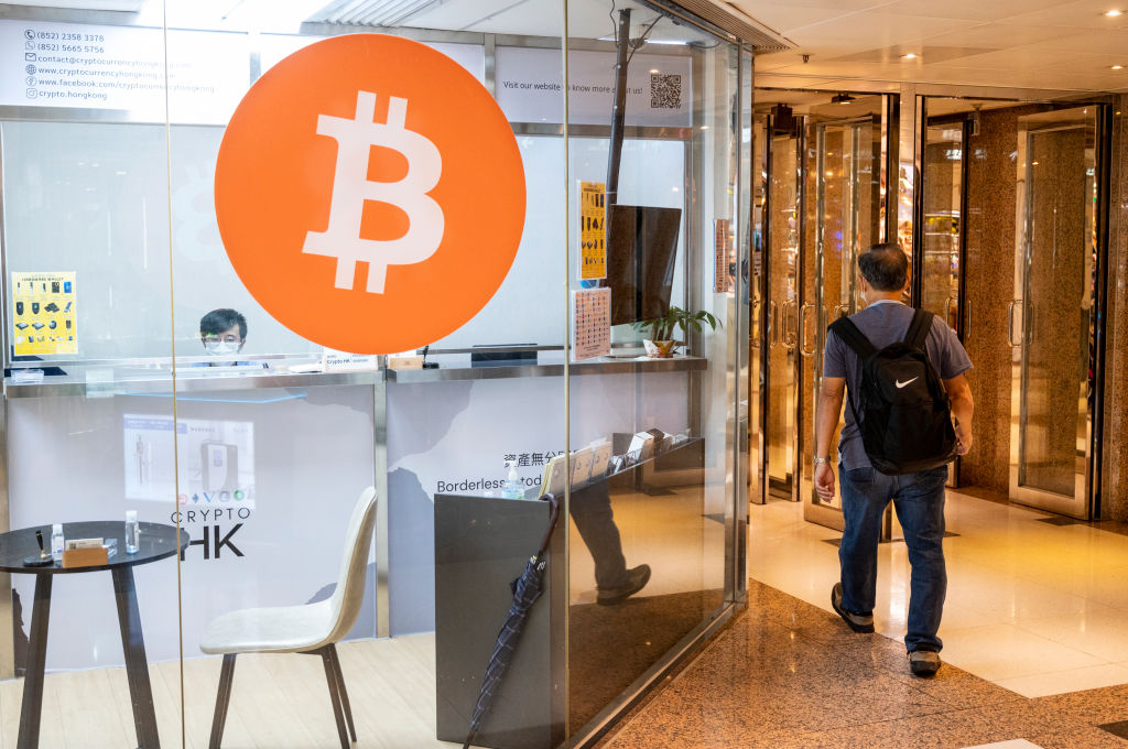 Hong Kong, China - 2022/07/13: A store displays cryptocurrency electronic cash Bitcoin (BTC, BCH) logo at its store in Hong Kong. (2022/07/13: A store Budrul Chukrut—SOPA Images/LightRocket/Getty Images)