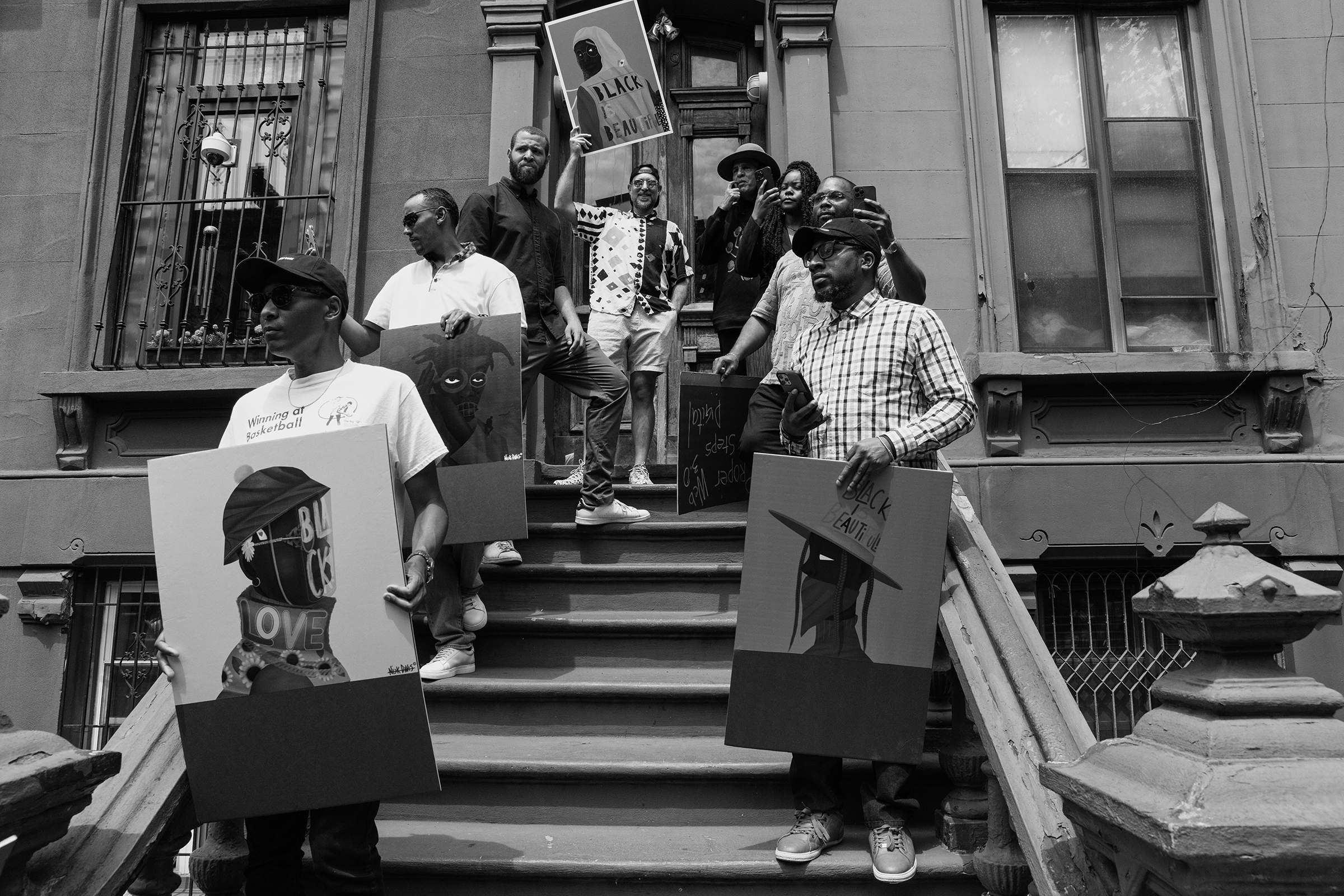 Several Black arts showcase their work from the Harlem stoop.