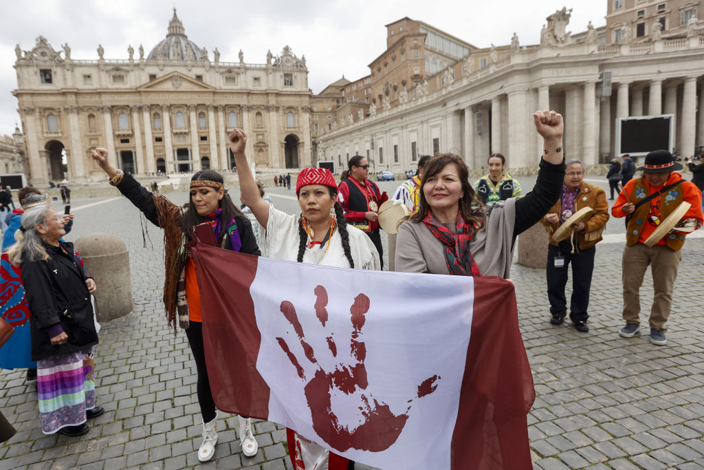 Members of the Indigenous Tourism Association of Canada and First Nations Assembly perform at Saint Peter's Square at the end of their meeting with Pope Francis in Vatican City, Vatican, on April 1, 2022. (Riccardo De Luca—Anadolu Agency/Getty Images)