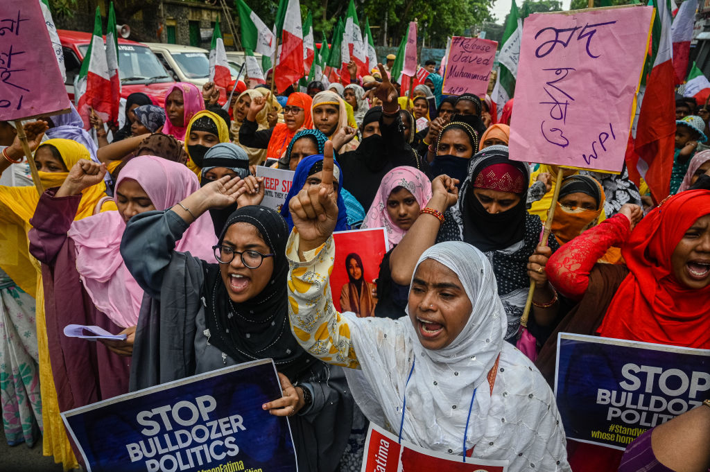 Muslim women shout slogans during a demonstration in support of Muslim activist Afreen Fatima, in Kolkata on June 15, 2022. (Sankhadeep Banerjee—NurPhoto/Getty Images)