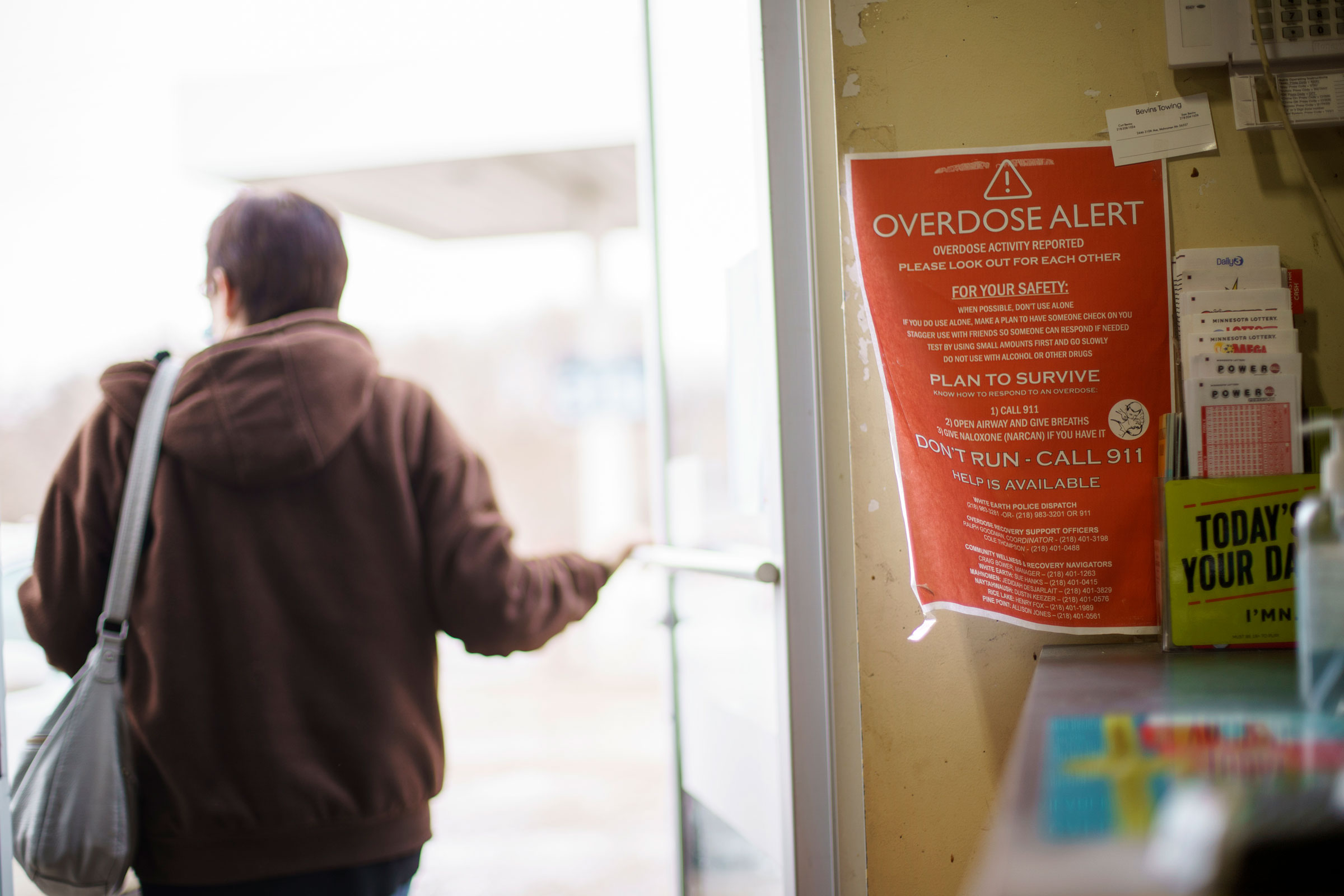 A sign calling attention to drug overdoses is posted to the door of a gas station on the White Earth reservation in Ogema, Minn., Tuesday, Nov. 16, 2021. (David Goldman—AP)