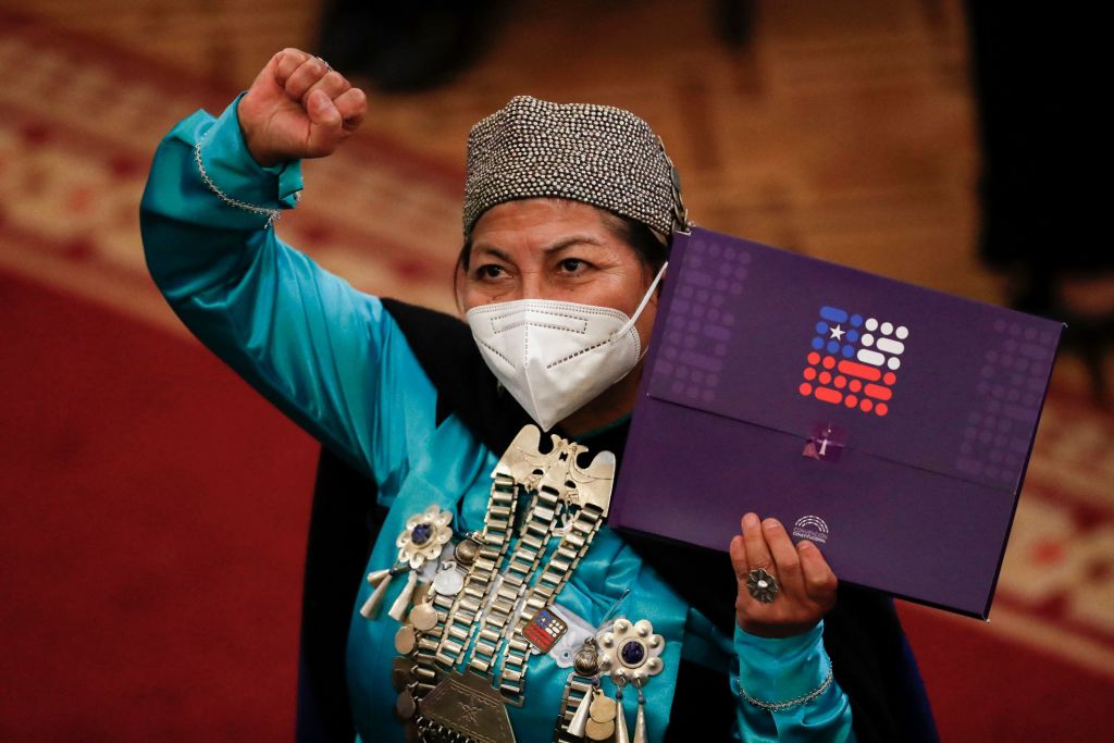 Elisa Loncón representative of the Mapuche people for the Chilean Constitutional Convention, holds the final draft of the constitutional proposal during its presentation at the National Congress, in Santiago, on July 4, 2022. (Javier Torres—AFP/Getty Images)
