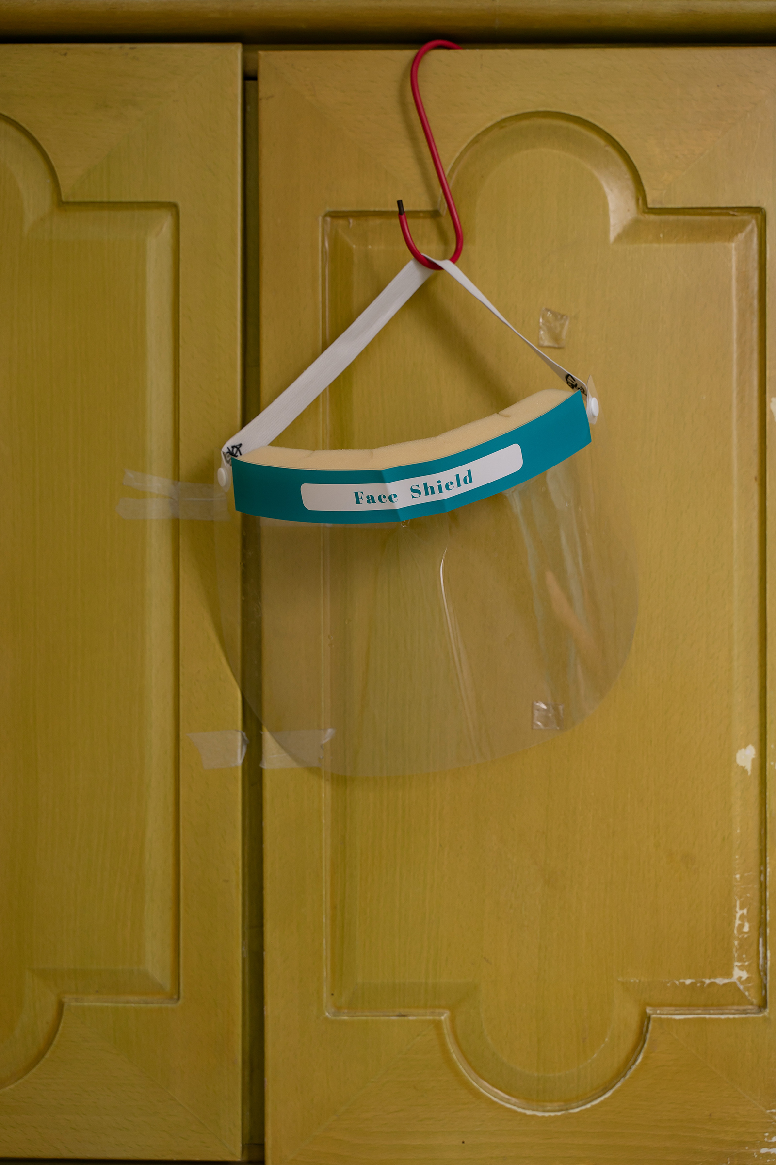 A face shield is hung on a cabinet at Kei Tak (Tai Hang) Home For The Aged.