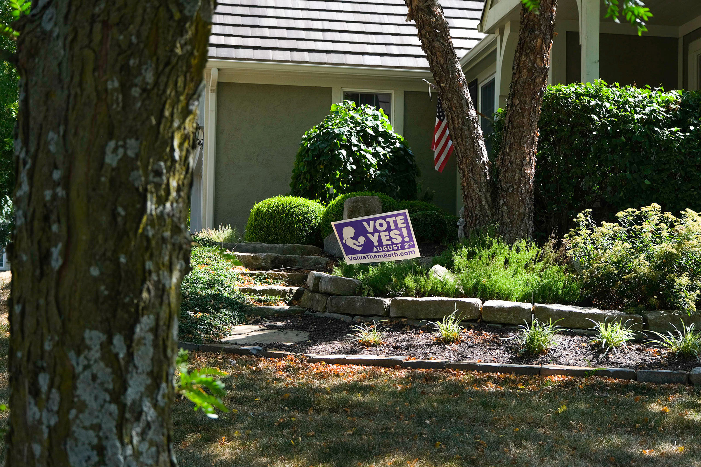 A 'Value Them Both' sign is displayed in yard of a home in Olathe, Kansas on July 23, 2022. Arin Yoon for TIME.