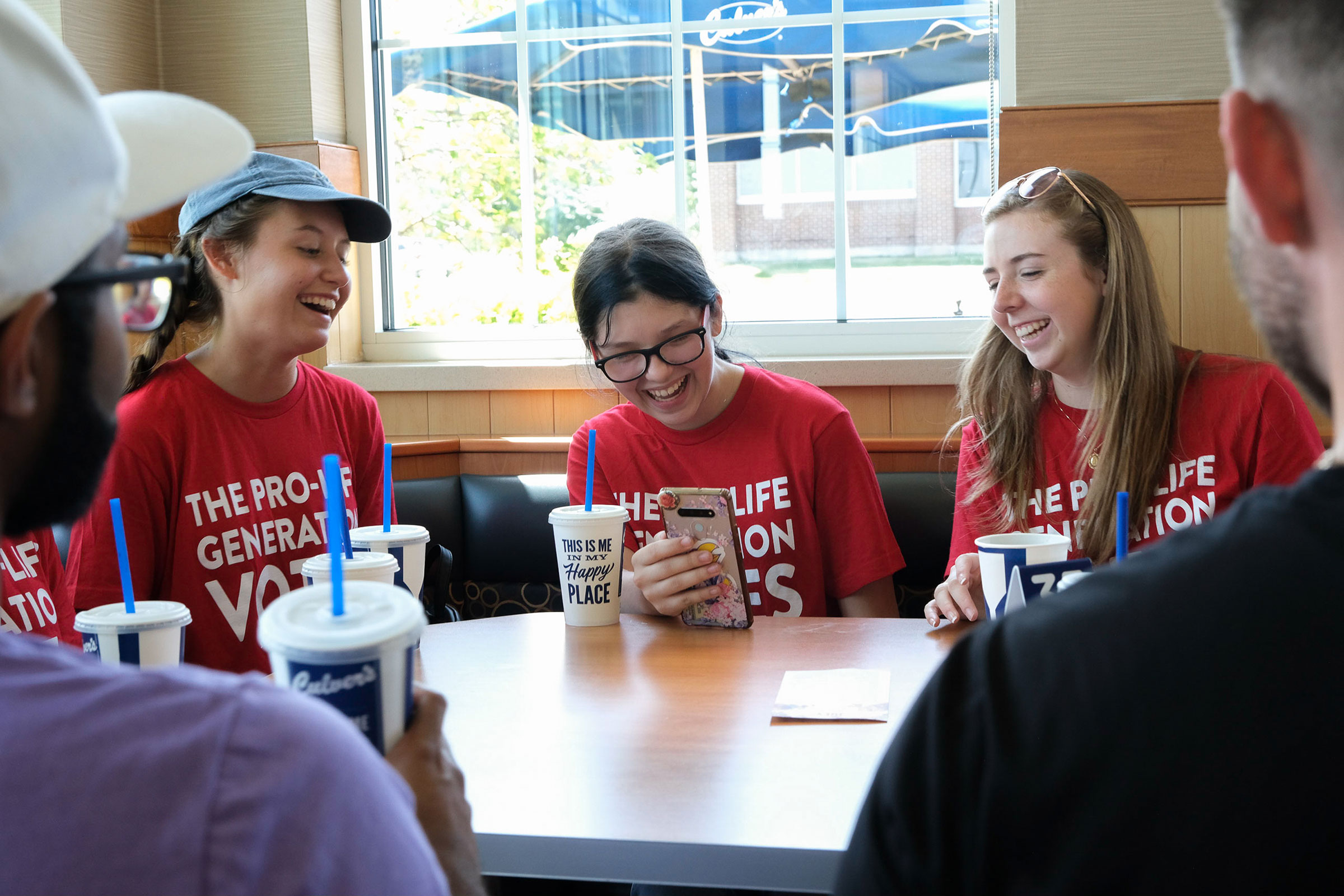 Students for Life of America volunteers take a break for lunch while canvassing in Johnson County on July 23. (Arin Yoon for TIME)