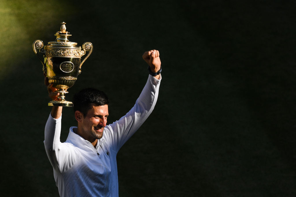 Serbia's Novak Djokovic poses with his trophy after beating Australia's Nick Kyrgios during the men's singles final tennis match on the fourteenth day of the 2022 Wimbledon Championships at The All England Tennis Club in Wimbledon, southwest London, on July 10, 2022. (Daniel Leal—AFP/Getty Images)