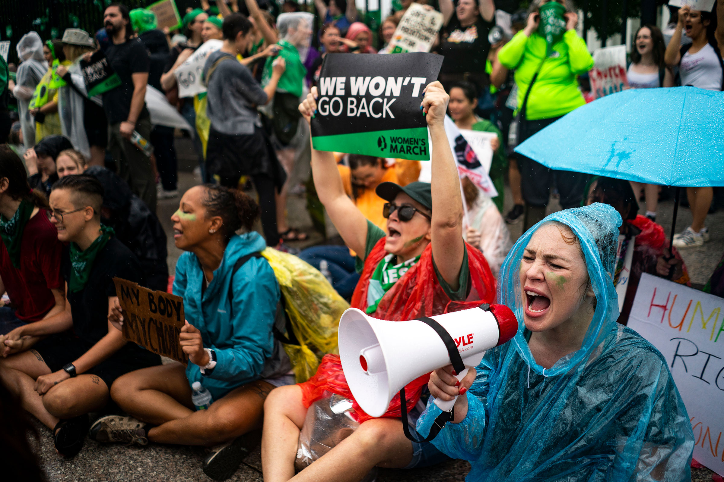 Abortion rights activists stage a sit-in just outside of the White House security fence to denounce the Supreme Court decision to end federal abortion rights protections on Jul. 9, 2022. (Kent Nishimura—Los Angeles Times/Getty Images)