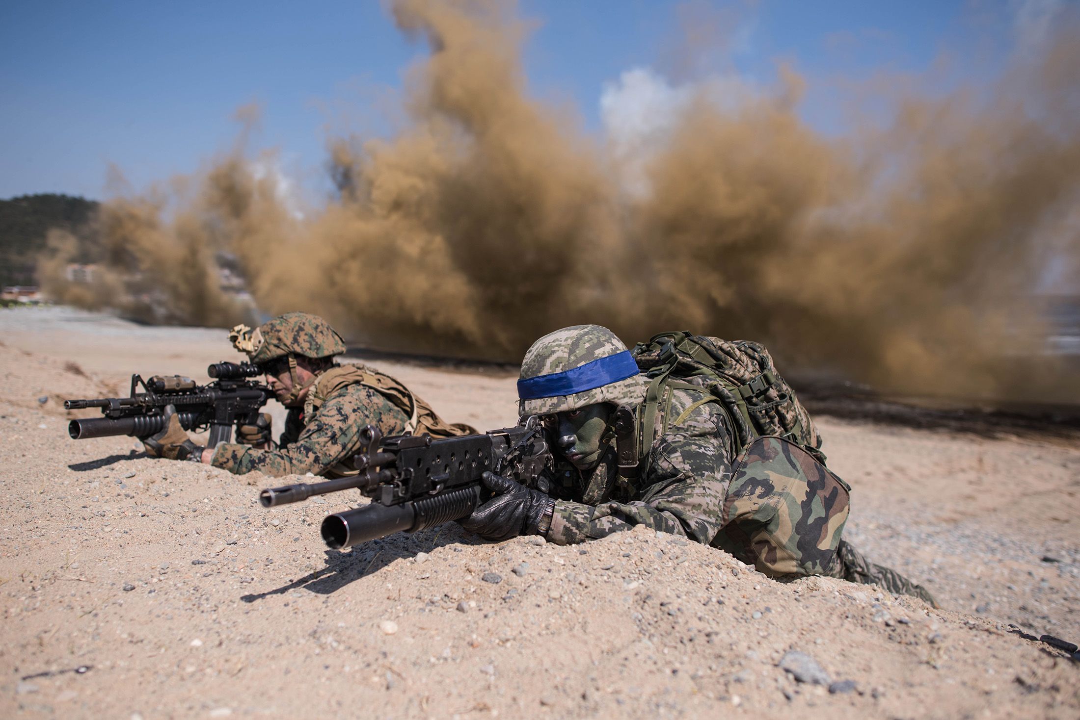 South Korean and U.S. soldiers take a position during an annual joint military landing exercise in Pohang, on South Korea's southeast coast, on March 12, 2016. (Ed Jones/AFP/Getty Images)