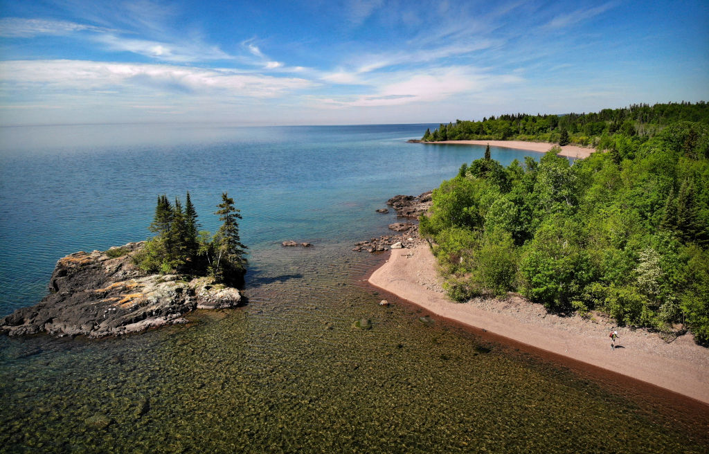The 1.6 mile Cakewalk north of Grand Marais is the only section of trail that runs along the shore of Lake Superior outside of the Duluth Lake Walk. Here, Melanie McManus hikes the rocky shore of Lake Superior past the Tombolo Island. (Brian Peterson-Star Tribune/Getty Images)