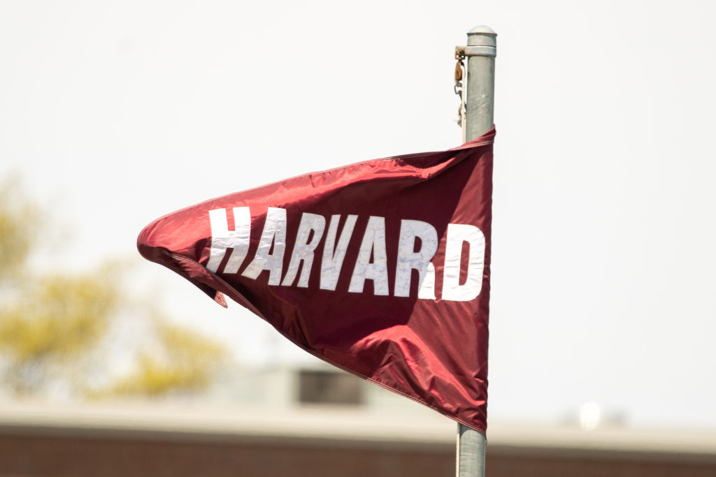 A Harvard Crimson flag waves in the wind during the Ivy League Tournament championship college lacrosse game between the Pennsylvania Quakers and the Yale Bulldogs on May 8, 2022. (Erica Denhoff—Icon Sportswire/Getty Images)