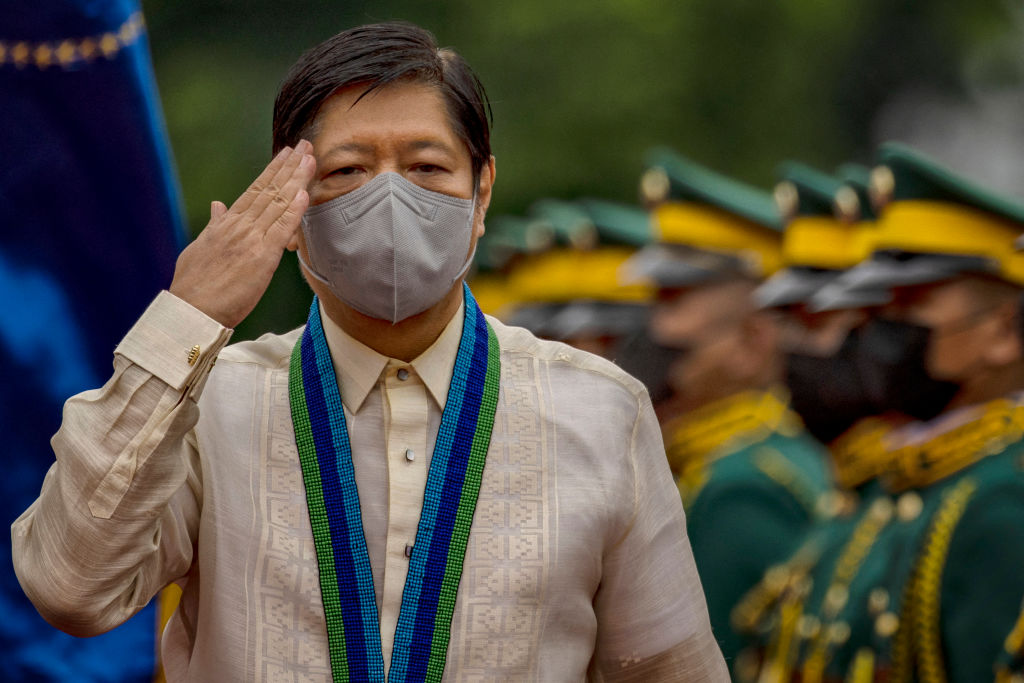 Philippine President Ferdinand Marcos Jr inspects troops during a change of command ceremony at Camp Aguinaldo in Quezon City, suburban Manila on August 8, 2022. (EZRA ACAYAN/POOL/AFP via Getty Images)