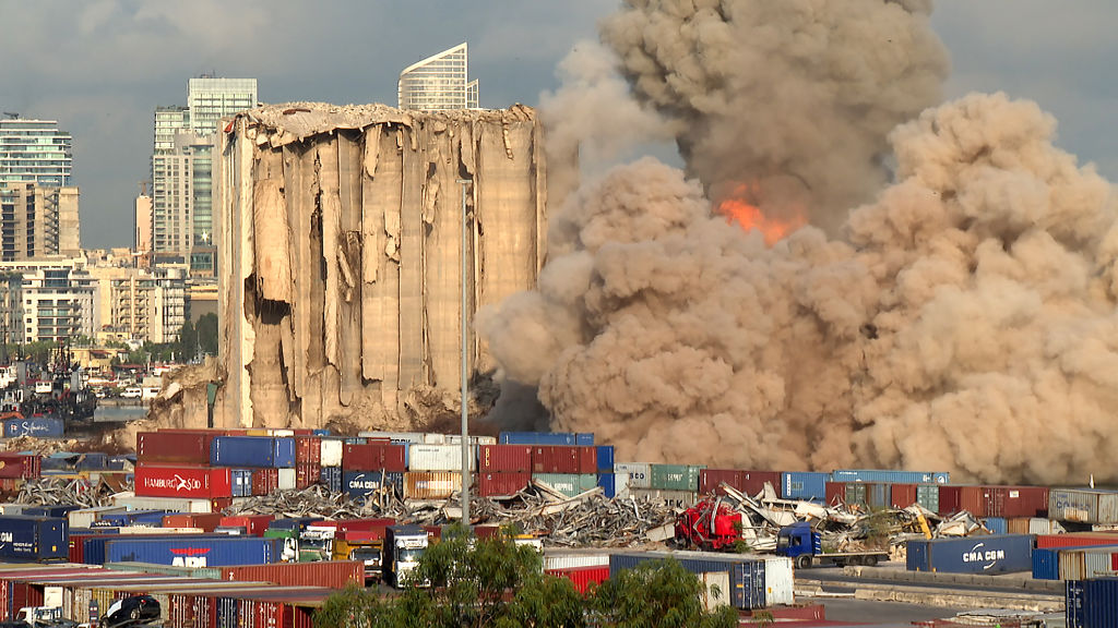 This grab from AFPTV footage shot on Aug. 23, 2022 shows a smoke plume rising after more of the northern section of the grain silos at the port of Lebanon's capital Beirut, which were previously partly destroyed by the 2020 port explosion. (Dylan Collins—AFP via Getty Images)