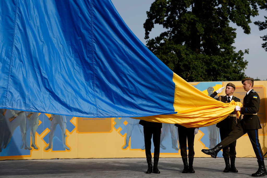 Members of the Ukrainian military attend a flag-raising ceremony at Hetman Petro Sahaidachny National Ground Forces Academy on Aug. 23, 2022 in Lviv, Ukraine. Aug. 24 marks six months since Russia launched its large-scale invasion of Ukraine. It is also the day Ukraine celebrates its 1991 independence from the Soviet Union. (Jeff J. Mitchell—Getty Images)