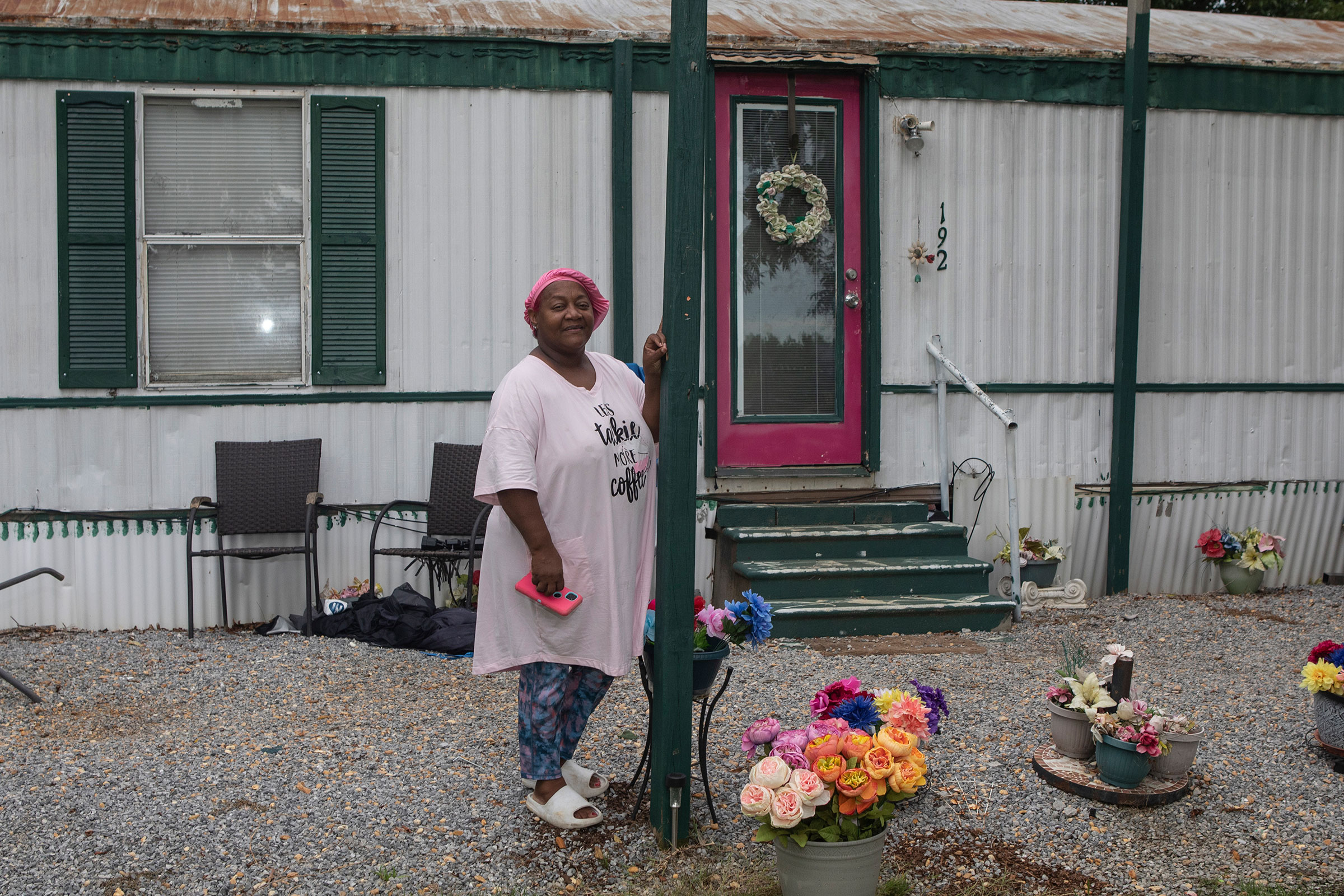 Gladys Grant stands in front of her home in Lowndes County Alabama on August 1st, 2022. Gladys and her family have been residents of Lowndes County for many generations.