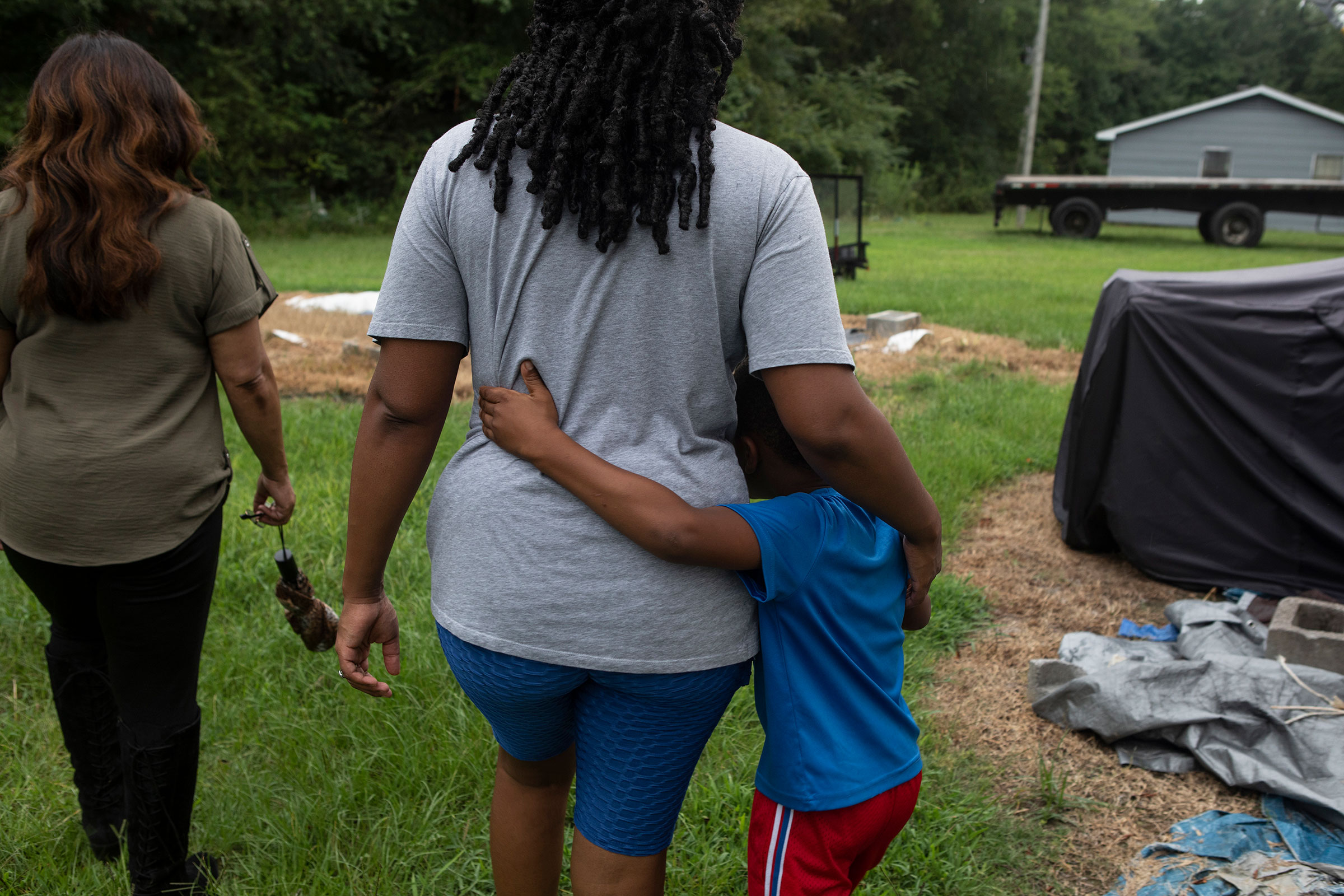 Residents of Lowndes County, who are struggling with sewage problems, walk alongside Catherine Flowers. (Charity Rachelle for TIME)