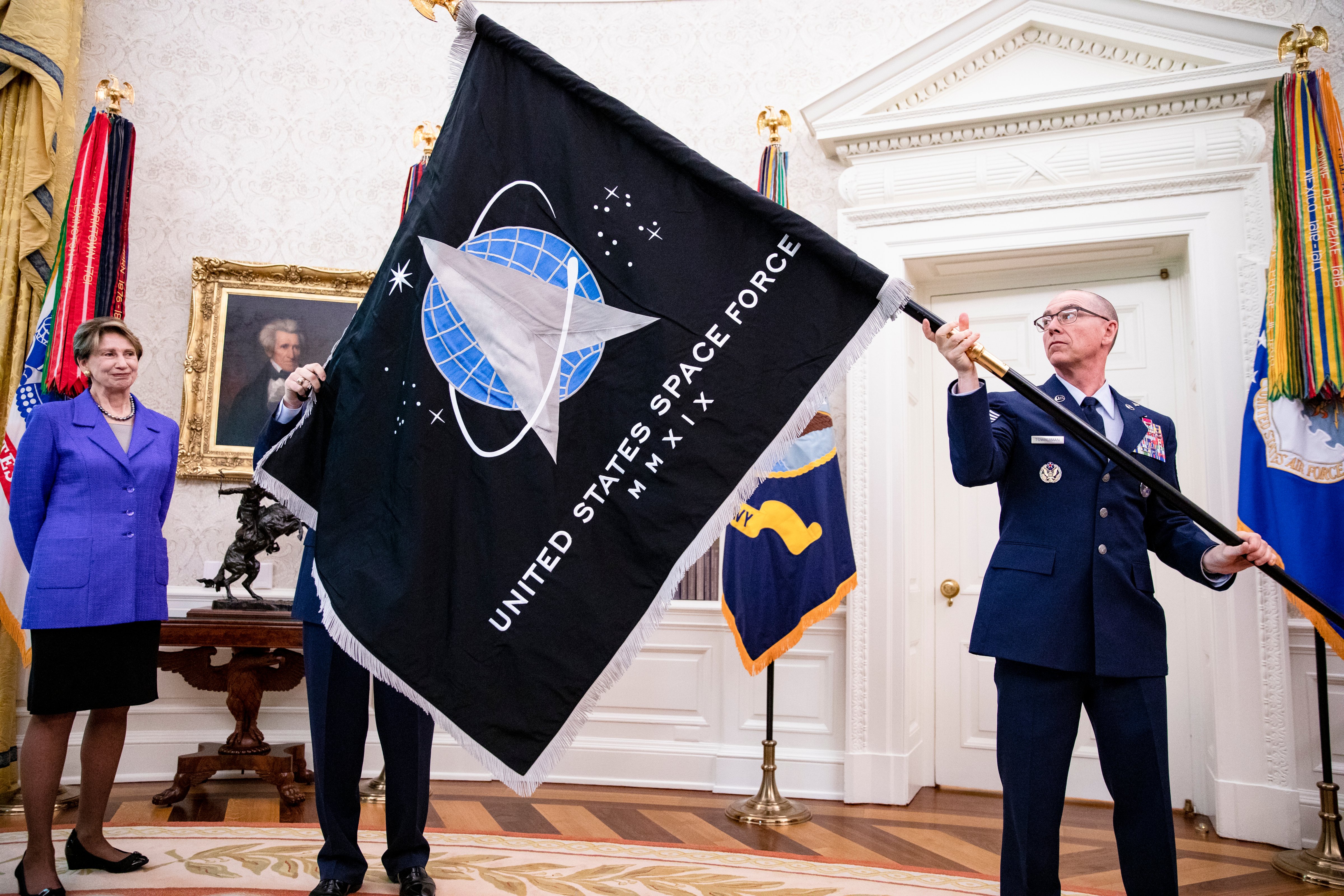The flag of the U.S. Space Force was unveiled to then-President Donald Trump, in the Oval Office, on May 15, 2020 (Photo by Samuel Corum-Pool/Getty Images)