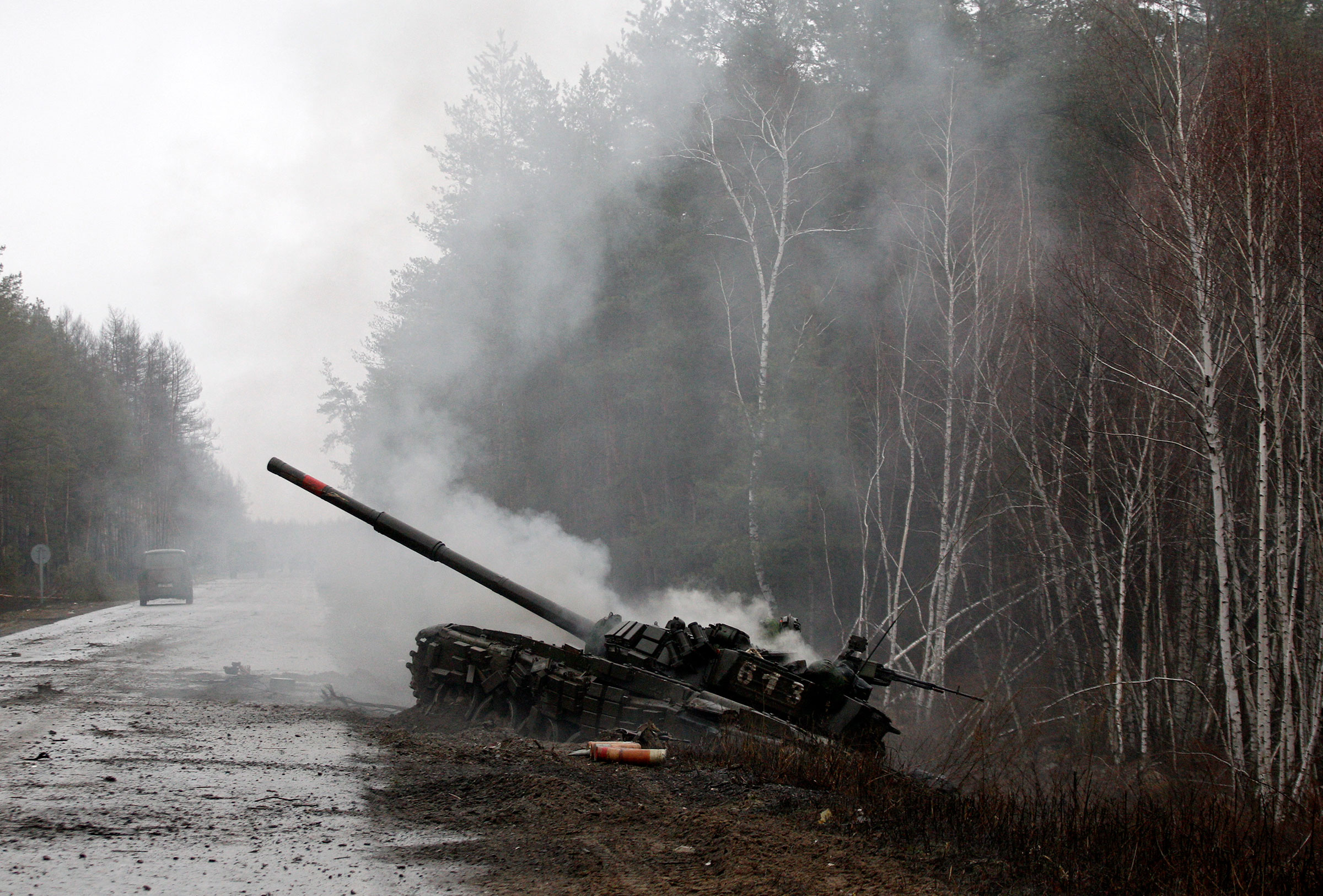 Smoke rises from a Russian tank destroyed by Ukrainian forces, on the side of a road in Lugansk region on Feb. 26, 2022. (AFP via Getty Images)