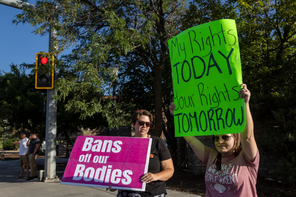 Ashley Ralston and Keri Taylor protest in support of abortion rights in Idaho Falls, Idaho, on August 25, 2022 (Natalie Behring—Getty Images)