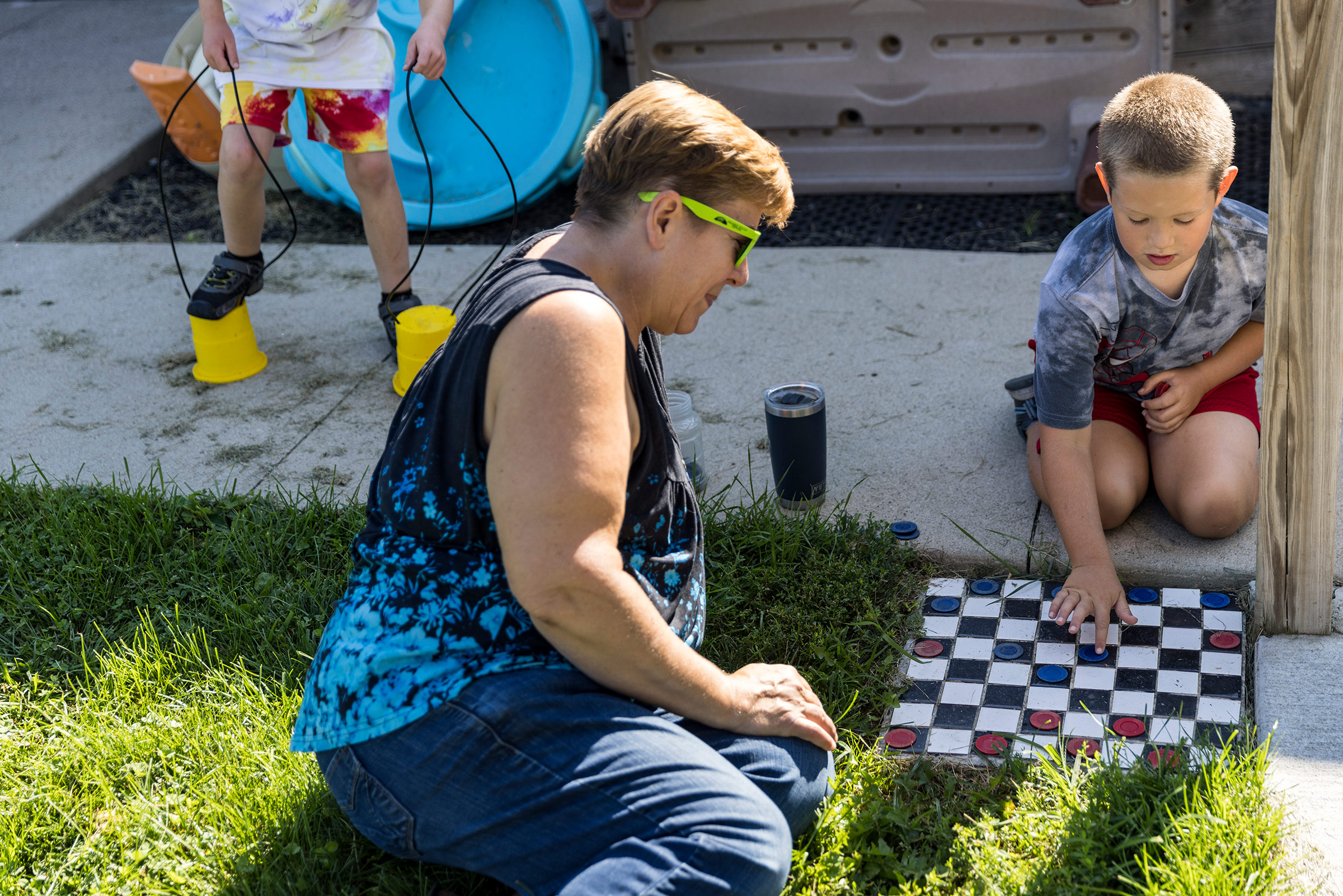 Deborah VanderGaast plays checkers with Brody Wendt, age 8. (Kathryn Gamble for TIME)