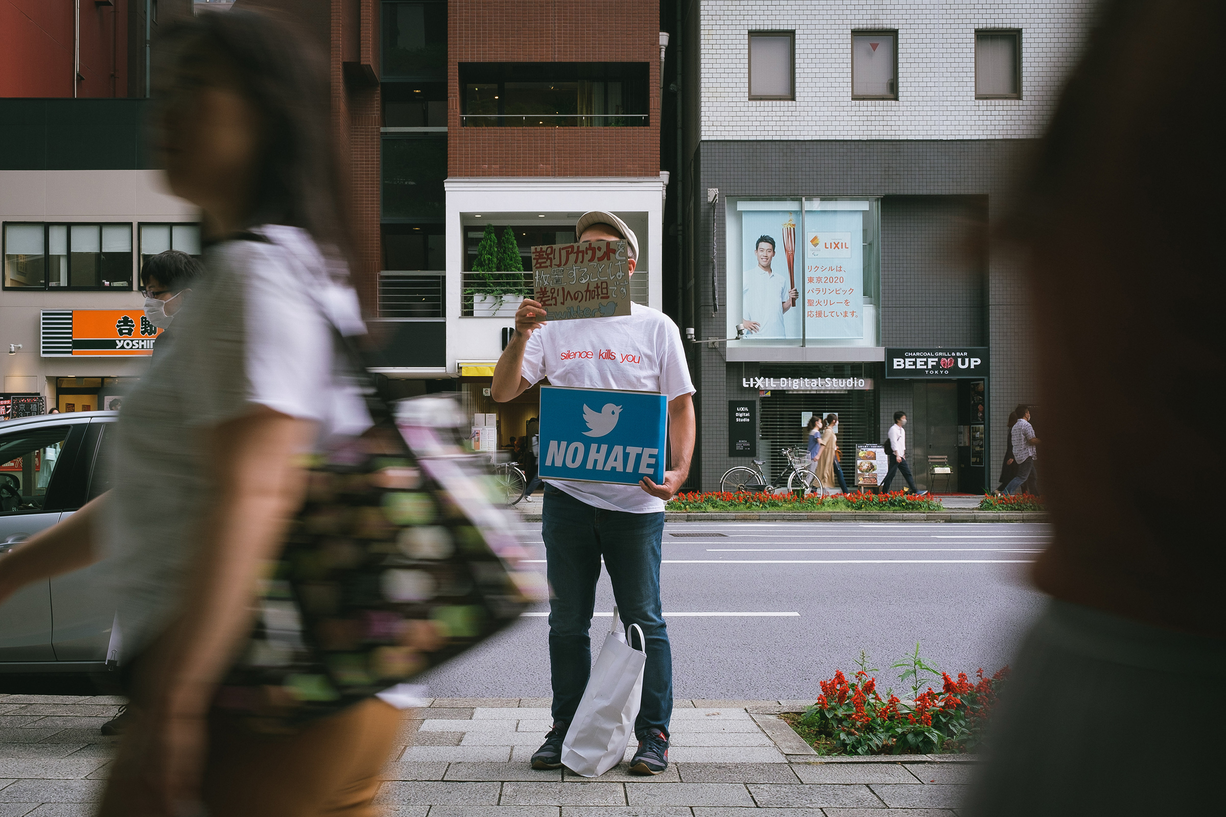 People gather in front of Twitter Japan headquarters in Tokyo to pressure the company to be more active against hate speech and discrimination on the platform, June 6, 2020. (Nicolas Datiche—AFLO/Reuters)