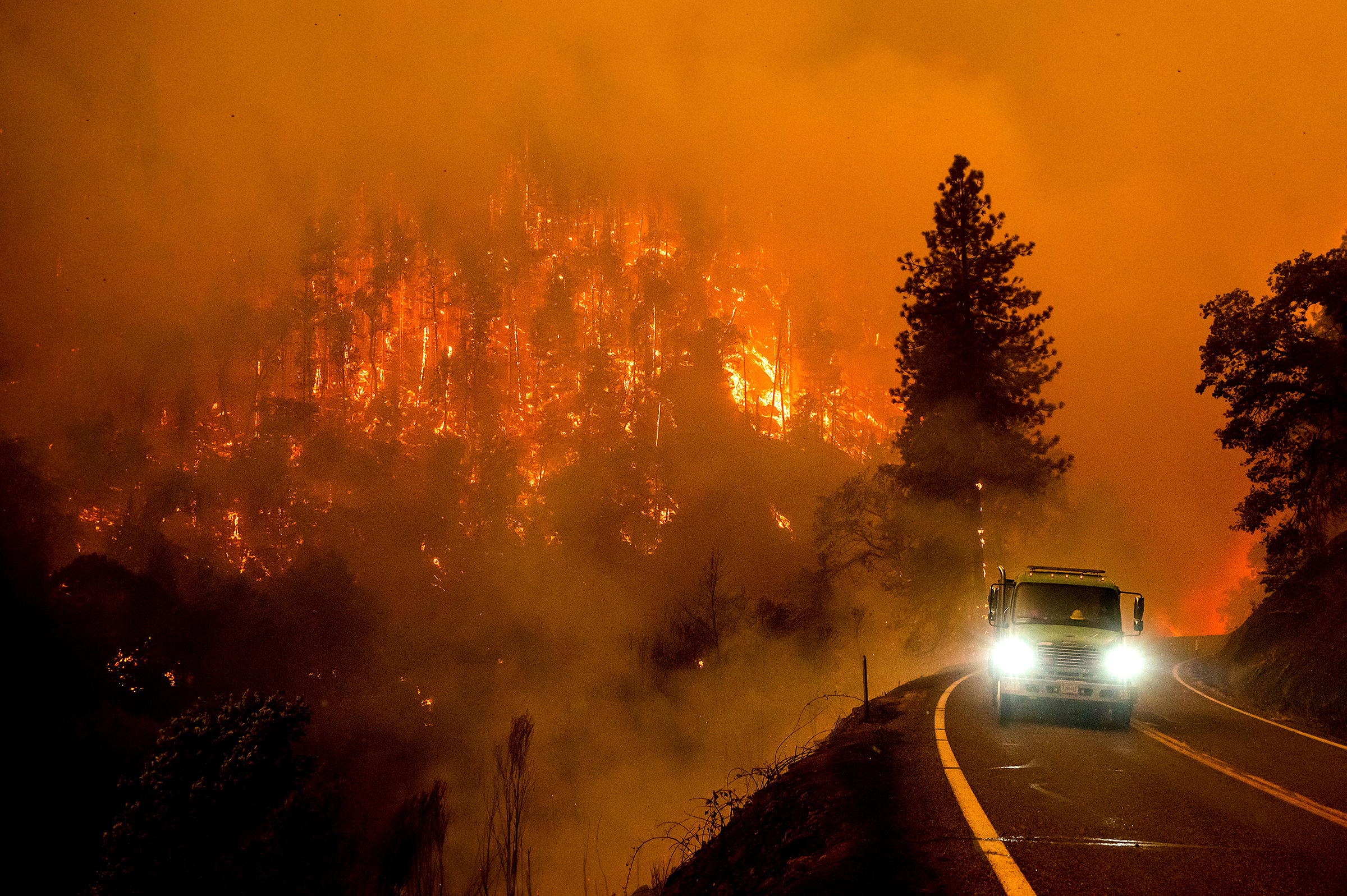 A firetruck drives along California Highway 96 as the McKinney Fire burns in Klamath National Forest, Calif., Saturday, July 30, 2022. (Noah Berger—AP)