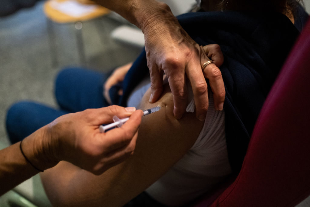 Injection of the third dose of the covid 19 vaccine at a Covid-19 vaccination center in Dinan, Brittany. France. (Martin Bertrand—Majority World/Universal Images Group/Getty Images)