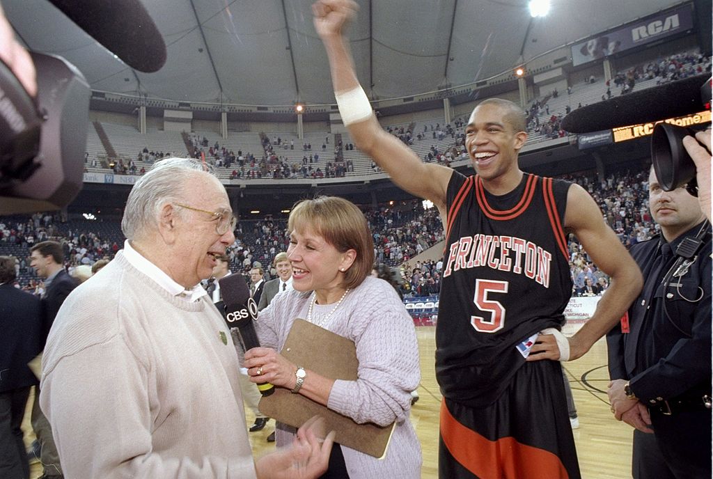 Guard Sydney Johnson and coach Pete Carril of the Princeton Tigers celebrate after a game against the UCLA Bruins at the RCA Dome in Indianapolis, Indiana. Princeton won the game, 43-41. (Jamie Squire /Allsport—Getty Images)
