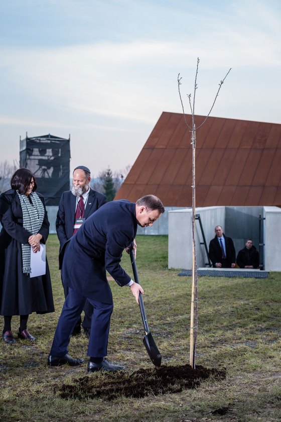 President Andrzej Duda is seen planting a tree before the opening ceremony of The Ulma Family Museum Of Poles Saving Jews in World War II