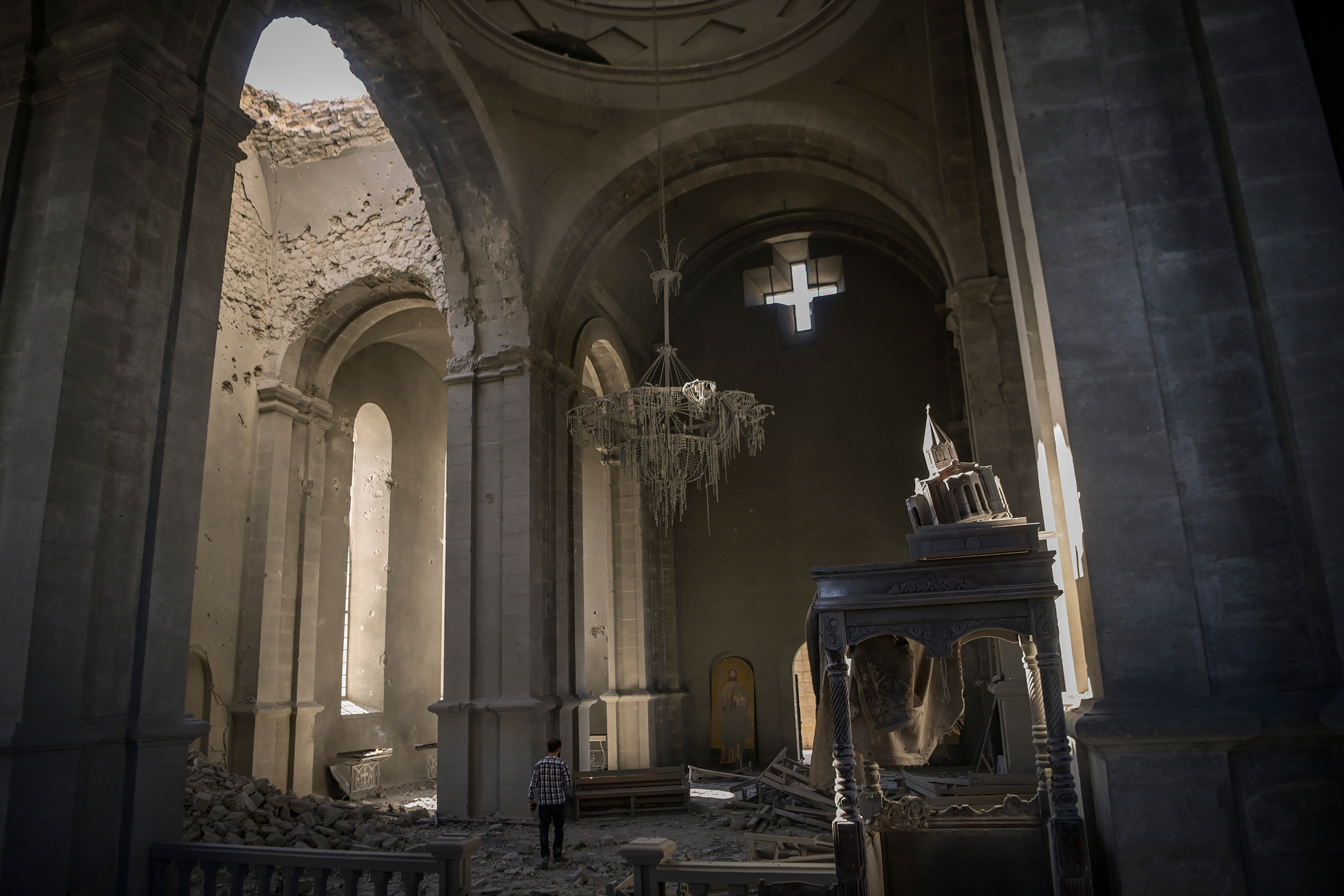A man enters the damaged Ghazanchetsots (Holy Savior) Cathedral in the historic city of Shusha, October 2020 (Aris Messinis—AFP/Getty Images)