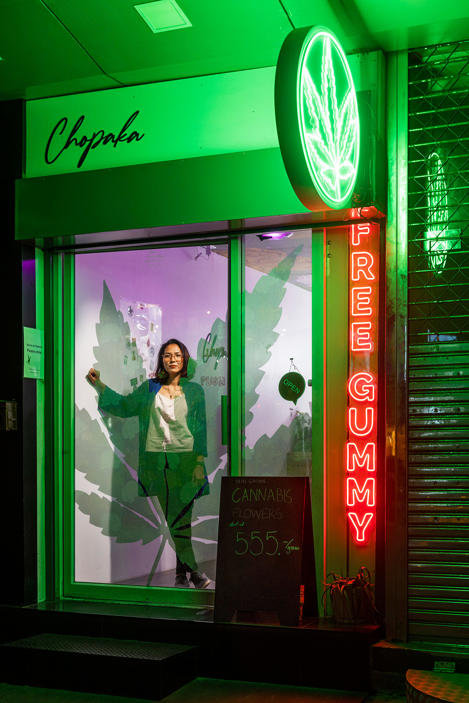 Chokwan “Kitty” Chopaka poses inside her cannabis dispensary on Bangkok’s Sukhumvit Road (Cedric Arnold for TIME)