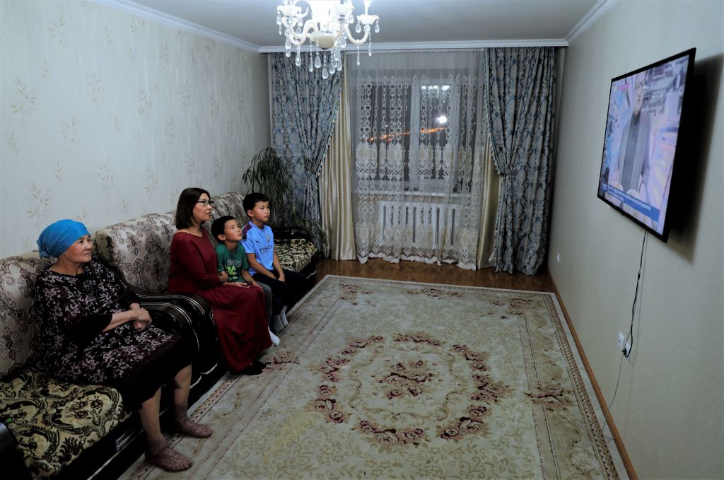 A Kazakh family watch a documentary on China-Kazakhstan economic cooperation at their home in Astana, then called Nur-Sultan, Kazakhstan, on Oct. 9, 2020. (Kalizhan Ospanov/Xinhua via Getty)