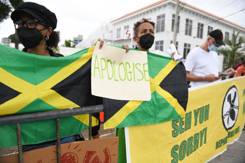 People calling for slavery reparations, protest outside the entrance of the British High Commission during the visit of the Duke and Duchess of Cambridge in Kingston, Jamaica on Mar. 22, 2022. (Ricardo Makyn—AFP via Getty Images)
