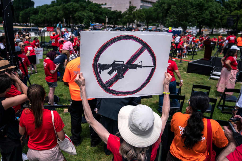 An attendee holds a sign calling for a ban on assault weapons during the Moms Demand Action Gun Violence Rally in Washington, D.C., on June 8, 2022 (Nathan Howard—Getty)
