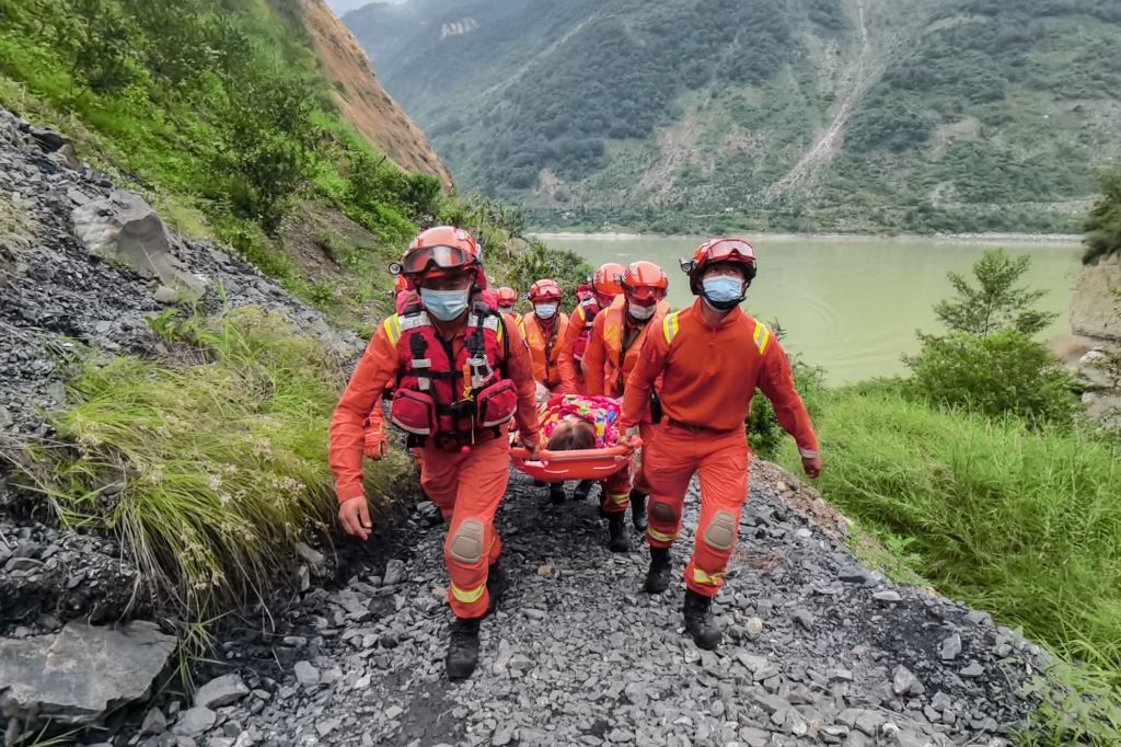Rescue workers carry an injured person after a 6.6-magnitude earthquake in Luding county, Ganzi Prefecture in China's southwestern Sichuan province on September 6, 2022. (CNS/AFP via Getty Images)