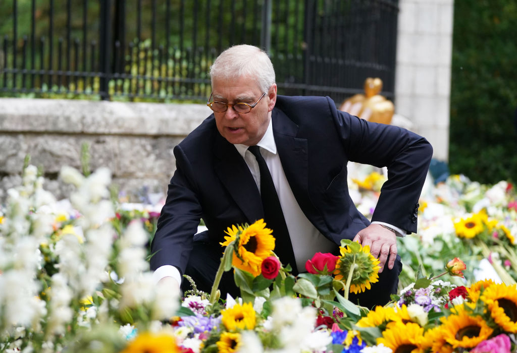 Prince Andrew looks at messages and floral tributes left by members of the public after attending a church service near Balmoral following the death of Queen Elizabeth II on Sept. 10, 2022. (Owen Humphreys—WPA Pool/Getty Images)