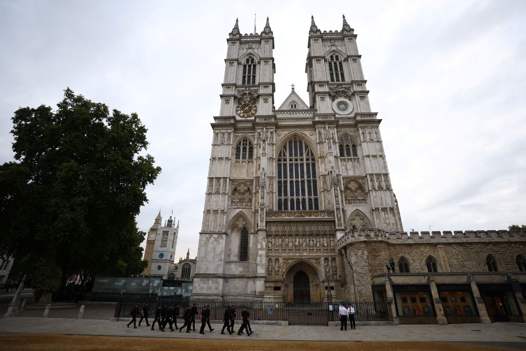 Police officers patrol outside Westminster Abbey in London on September 19, 2022, ahead of the state funeral service for Britain's Queen Elizabeth II.  (HANAH MCKAY/POOL/AFP via Getty Images)