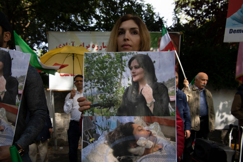 Women protest the death of Mahsa Amini in front of the Iranian embassy in Berlin on Sept. 17, 2022. (Paul Zinken—picture alliance/Getty Images)