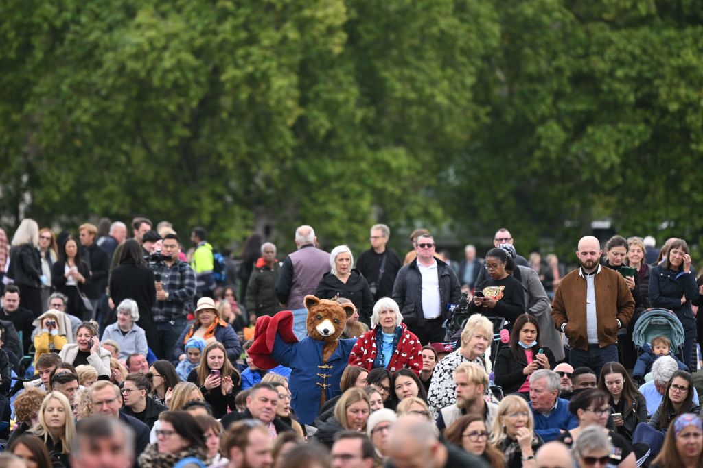 People gather in Hyde Park where the State Funeral Service of Britain's Queen Elizabeth II will be shown on a large screen in London on September 19, 2022. (JUSTIN TALLIS/AFP via Getty Images)