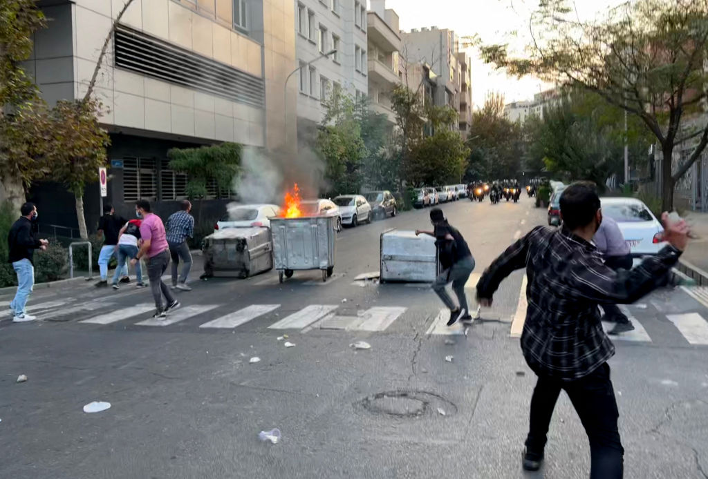 A picture obtained by AFP outside Iran shows a burning container in the middle of an intersection during protests in Tehran on September 20, 2022. (AFP via Getty Images)