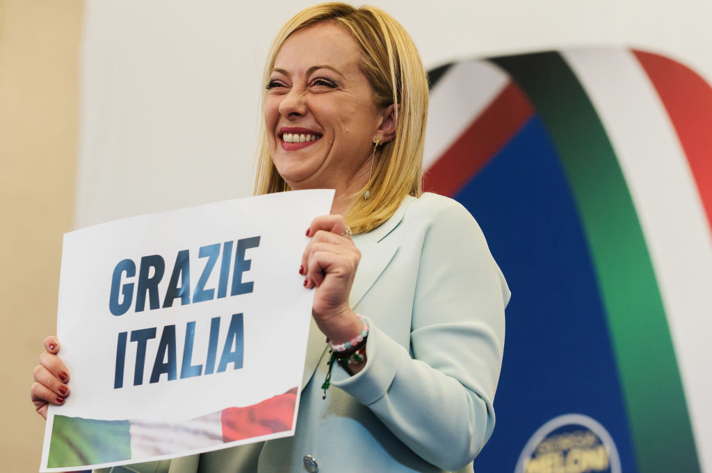 Giorgia Meloni is seen holding a placard quoting "Thanks Italy" in the press room. Giorgia Meloni, leader of the far-right and national-conservative party Fratelli d'Italia (Brothers of Italy), commented on the party's victory at the Italian elections, held on 25 September 2022 (Valeria Ferraro-SOPA Images/LightRocket)